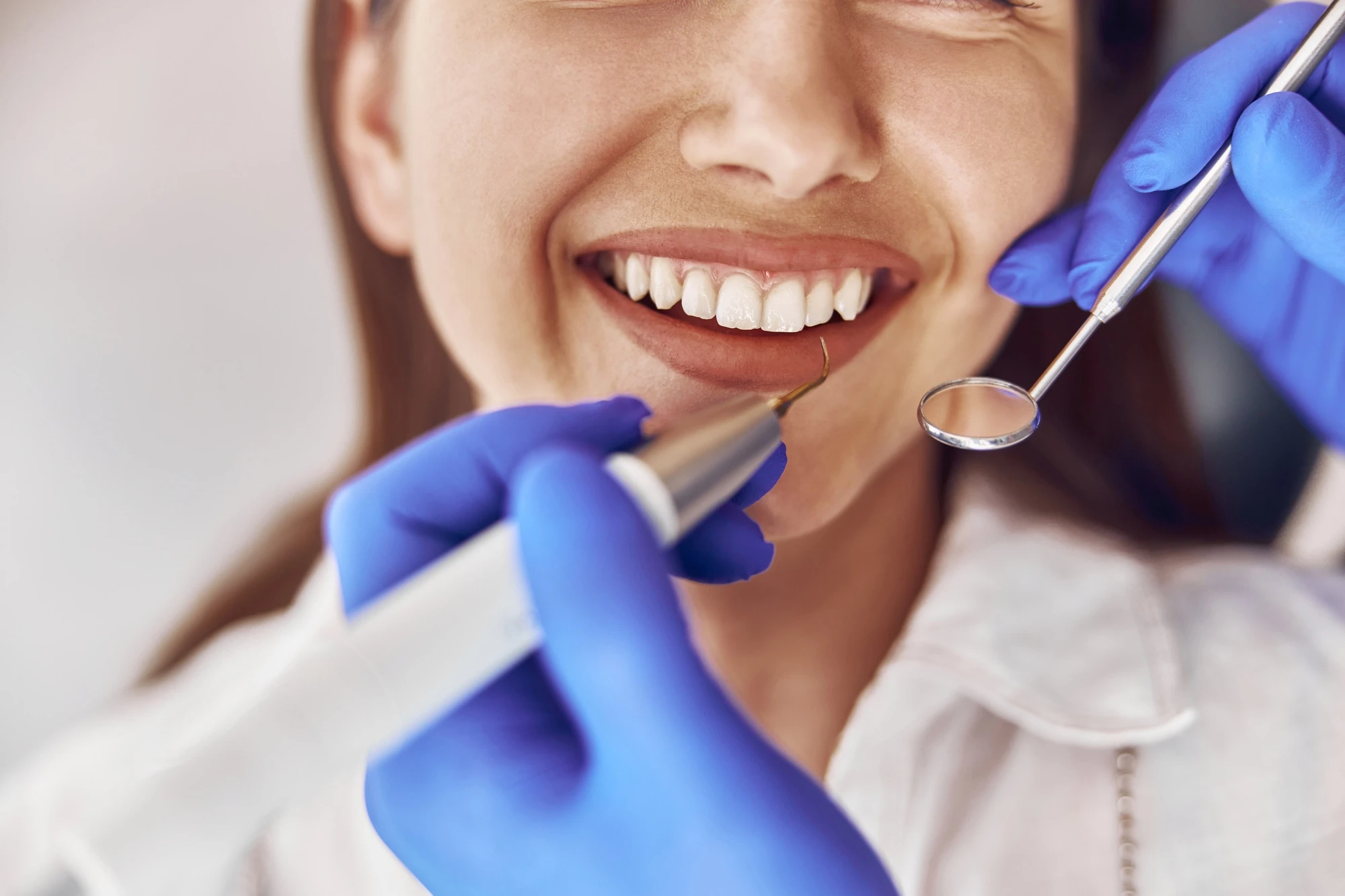 cosmetic-dentist-teeth-cleaning-closeup-tools