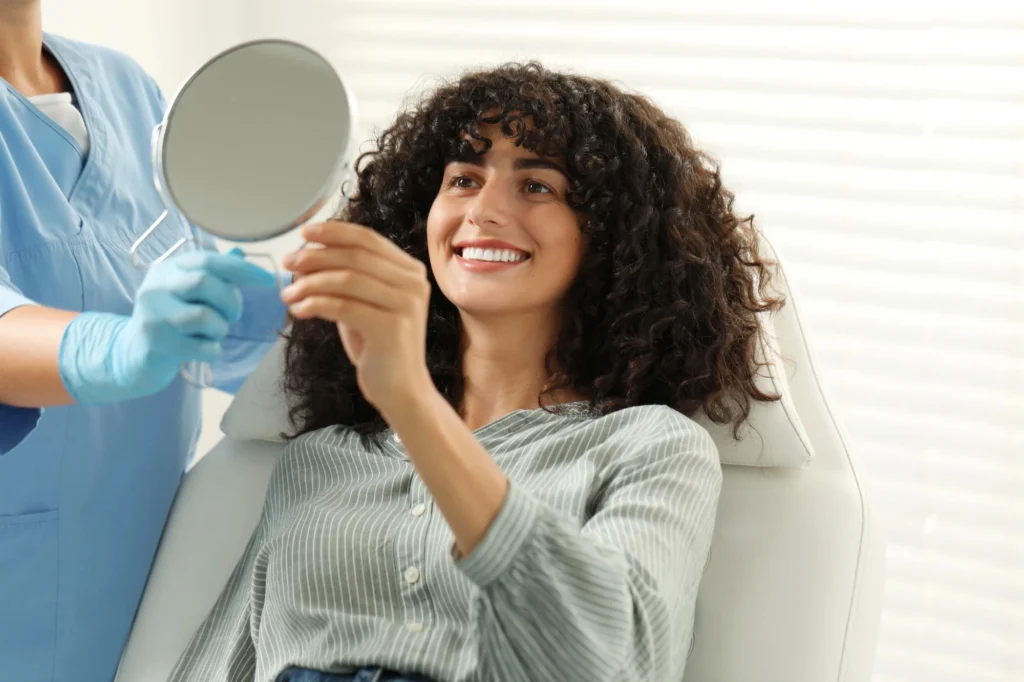 veneers in waxhaw smiling patient mirror