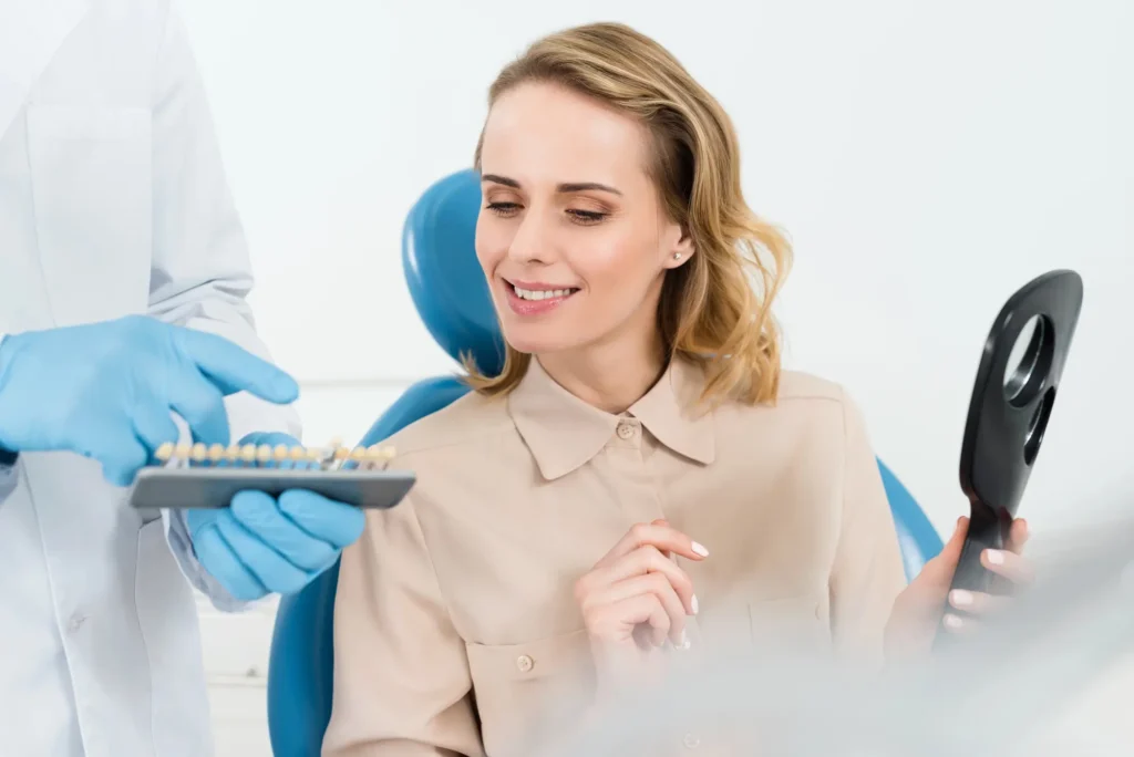 Doctor showing tooth implants to a patient for dental implants in Waxhaw
